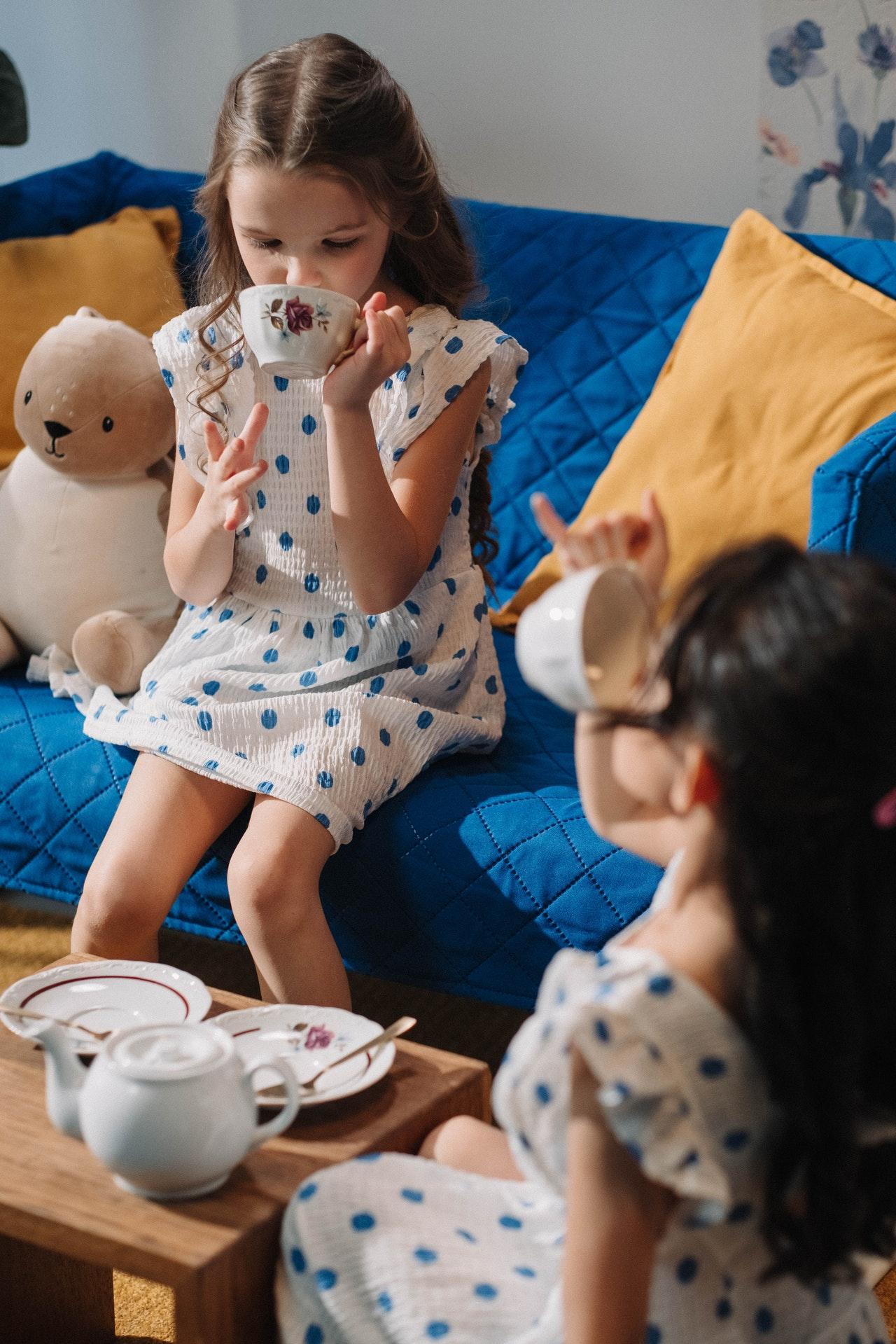Two girls playing tea party