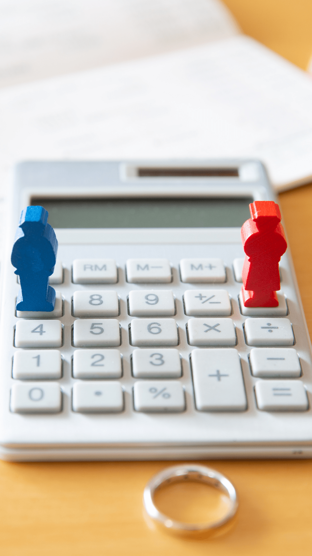 Man & woman figures on calculator
