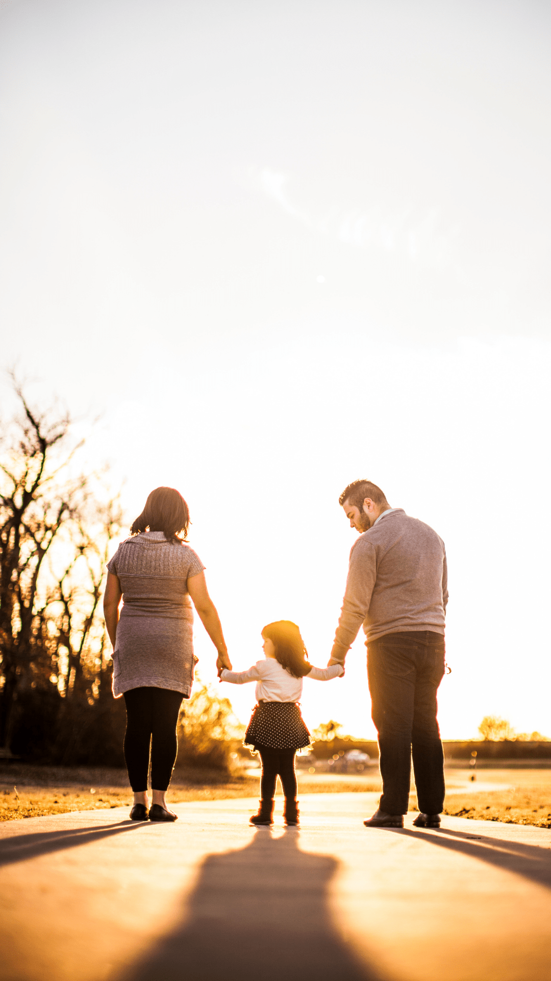 Parents walking with child